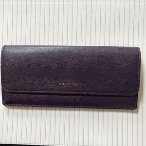 Purple Coach wallet in good condition.